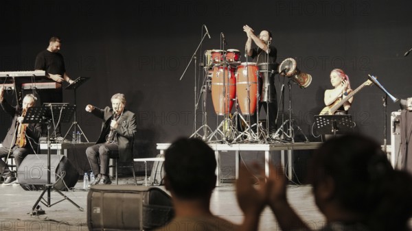 Musicians play on stage alongside Turkish singer Coskun Sabah during the Türkiye Kültür Yolu Festival, Gaziantep, Gaziantep, Türkiye