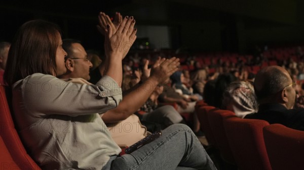 Audience members dance and clap as Turkish singer Coskun Sabah performs during the Türkiye Kültür Yolu Festival, Gaziantep, Gaziantep, Türkiye