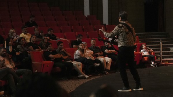 Audience members dance and clap as Turkish singer Coskun Sabah performs during the Türkiye Kültür Yolu Festival, Gaziantep, Gaziantep, Türkiye