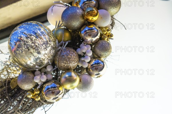 Christmas balls and lights hanging at night in bayonne, france, creating a festive atmosphere