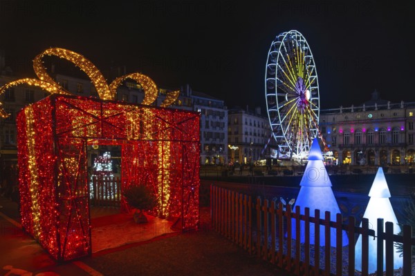 Festive christmas decorations illuminating bayonne's city center at night, creating a magical atmosphere