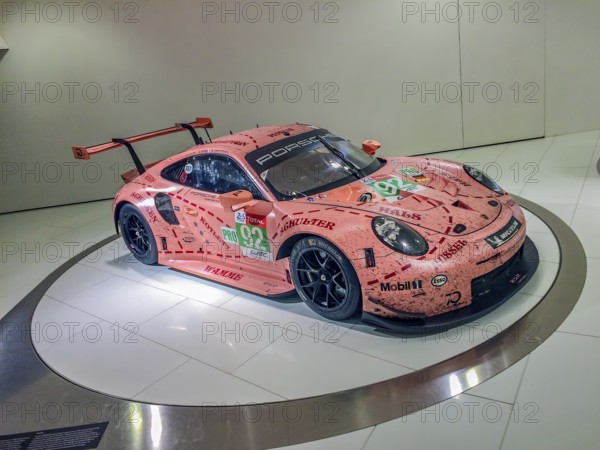 Porsche 911 GT3 RSR racing car with historic paintwork from Porsche 917 with nickname Sau, Porsche Museum, Stuttgart Zuffenhausen, Baden-Württemberg, Germany