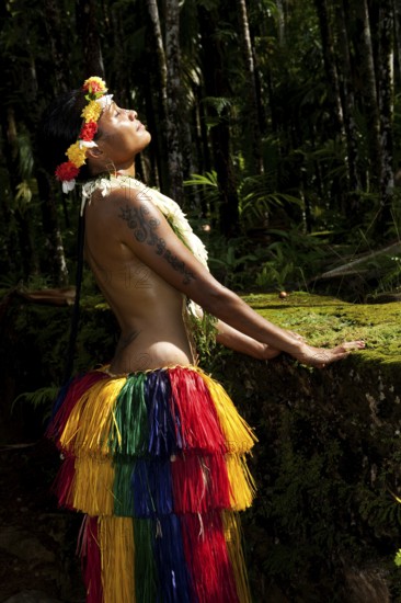 Young woman in traditional traditional costume enjoying the sun, Yap Island, Yap State, Caroline Islands, FSM, Federated States of Micronesia, Australia, Oceania