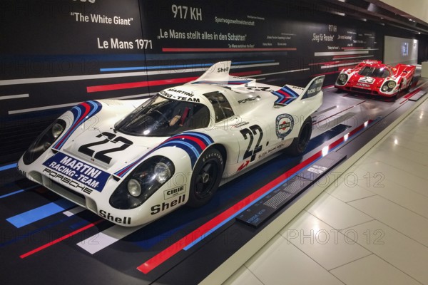 In the front, historic Porsche 917 No. 22 racing car with magnesium cage by racing driver Dr Helmut Marko Gijs van Lennep, overall winner of the 24 Hours 24 Hours of Le Mans 1971, small in the background Porsche 917 KH short tail from 1970 at the first Porsche overall victory of the 24 Hours 24 Hours of Le Mans by racing driver Hans Hermann Richard Attwood, Porsche Museum, Stuttgart Zuffenhausen, Baden-Württemberg, Germany