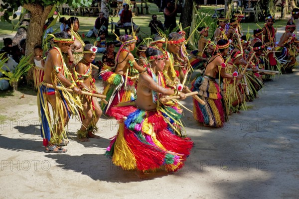 Traditional group of dancers from Yap Island dancing in historical traditional costume headdress performing traditional ritual bamboo dance stick dance with bamboo sticks ritual, Yap Island, Yap State, Caroline Islands, FSM, Federated States of Micronesia, Australia, Oceania