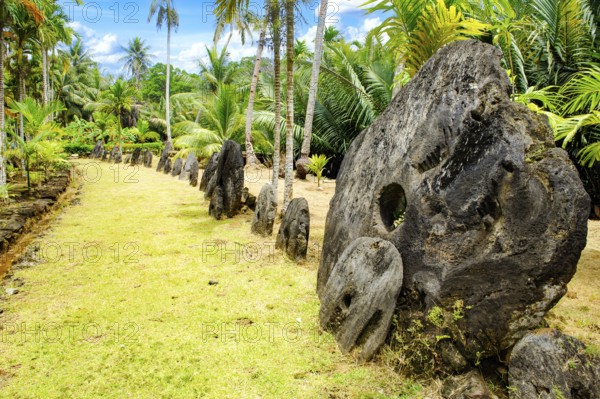 Oversized large giant stone coins real currency in stone money bank stone money bank in jungle of Yap Island, Yap Island, Yap State, Caroline Islands, FSM, Federated States of Micronesia, Australia, Oceania