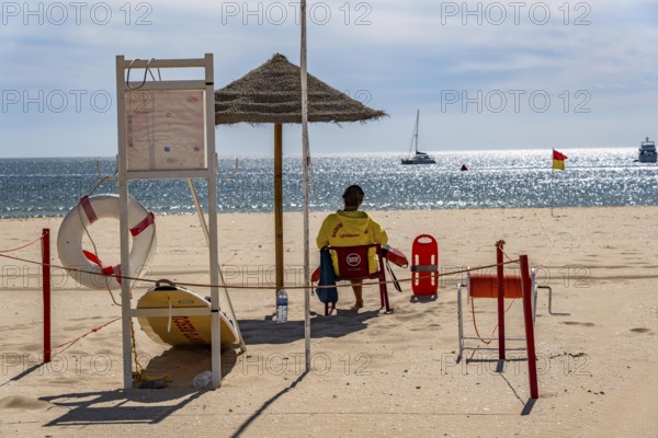 The Praia de São Roque beach, east of Lagos town centre, quite empty, lifeguards on duty, off-season, in the west of the Algarve, Portugal