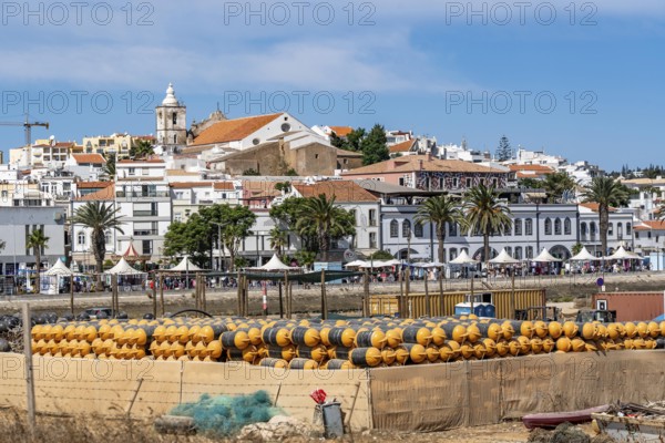 The skyline of the old town of Lagos, on the river Bensafrim, harbour channel, in the west of the Algarve, Portugal