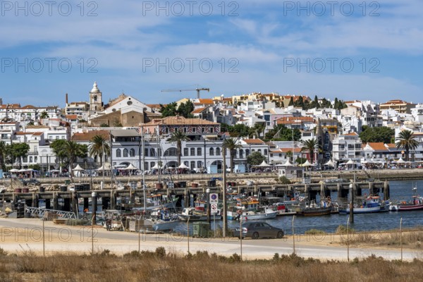The skyline of the old town of Lagos, on the river Bensafrim, harbour channel, in the west of the Algarve, Portugal