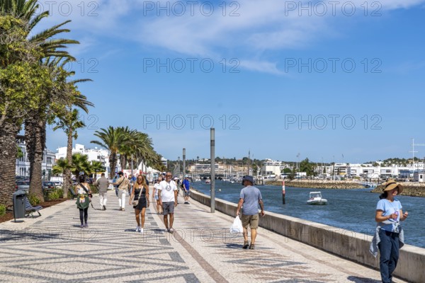 The skyline of the old town of Lagos, on the river Bensafrim, promenade along the harbour channel, in the west of the Algarve, Portugal