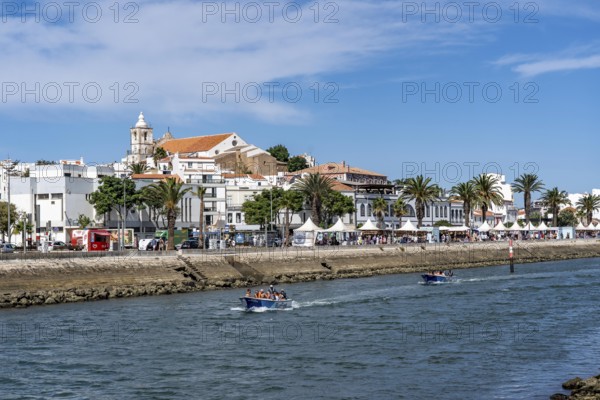 The skyline of the old town of Lagos, on the river Bensafrim, harbour channel, in the west of the Algarve, Portugal