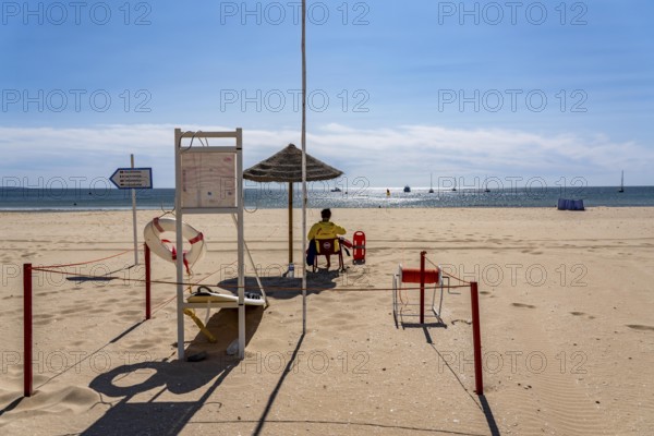 The Praia de São Roque beach, east of Lagos town centre, quite empty, lifeguards on duty, off-season, in the west of the Algarve, Portugal