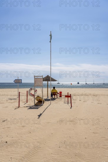 The Praia de São Roque beach, east of Lagos town centre, quite empty, lifeguards on duty, off-season, in the west of the Algarve, Portugal