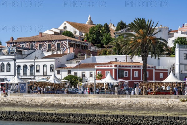 The skyline of the old town of Lagos, on the river Bensafrim, harbour channel, in the west of the Algarve, Portugal