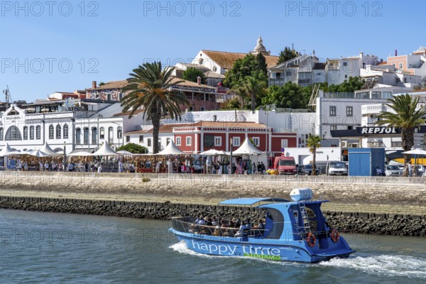 The skyline of the old town of Lagos, on the river Bensafrim, harbour channel, in the west of the Algarve, Portugal