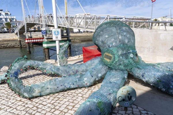 Figure of an octopus, filled with PET bottles, plastic products, reminder not to produce so much plastic waste, in the Marina de Lagos, marina, Lagos, in the west of the Algarve, Portugal