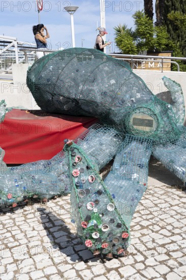 Figure of an octopus, filled with PET bottles, plastic products, reminder not to produce so much plastic waste, in the Marina de Lagos, marina, Lagos, in the west of the Algarve, Portugal