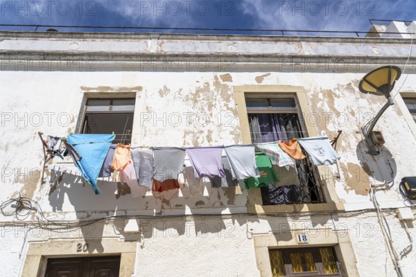 The old town centre of Lagos, laundry hanging to dry in front of the house, in the west of the Algarve, Portugal