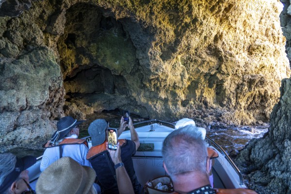 Tour with a small motorboat to the Ponta da Piedade rocky coast, rugged coastal landscape, right next to the city centre of Lagos, in the west of the Algarve, Portugal