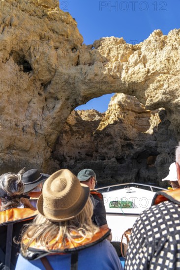 Tour with a small motorboat to the Ponta da Piedade rocky coast, rugged coastal landscape, right next to the city centre of Lagos, in the west of the Algarve, Portugal