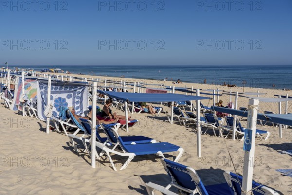 Kilometre-long sandy beach Praia do Barril, on the island off Santa Luzia, Algarve, Portugal