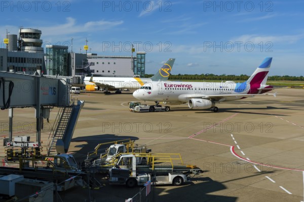 Düsseldorf, North Rhine-Westphalia, Germany - Düsseldorf Airport, aircraft of the airlines Eurowings and Condor at the terminal with air traffic control tower
