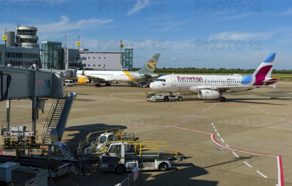Düsseldorf, North Rhine-Westphalia, Germany - Düsseldorf Airport, aircraft of the airlines Eurowings and Condor at the terminal with air traffic control tower