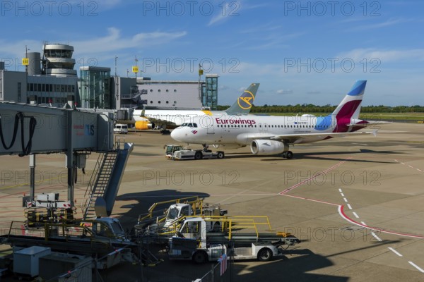 Düsseldorf, North Rhine-Westphalia, Germany - Düsseldorf Airport, aircraft of the airlines Eurowings and Condor at the terminal with air traffic control tower