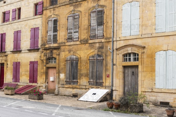 Historic house facade, abandoned building, yellow sandstone, Marville, Renaissance village, Département Meuse, Grand Est, France