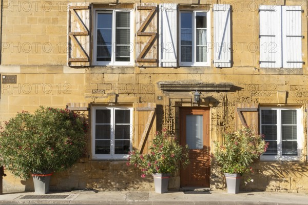 Renovated building, historic house façade, yellow sandstone, Marville, Renaissance village, Département Meuse, Grand Est, France