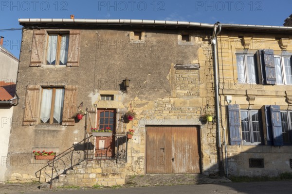 Historic house façade, yellow sandstone, Marville, Renaissance village, Département Meuse, Grand Est, France