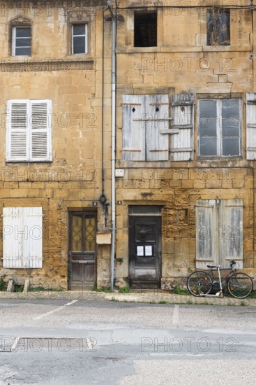 Historic house facade, abandoned building, yellow sandstone, Marville, Renaissance village, Département Meuse, Grand Est, France