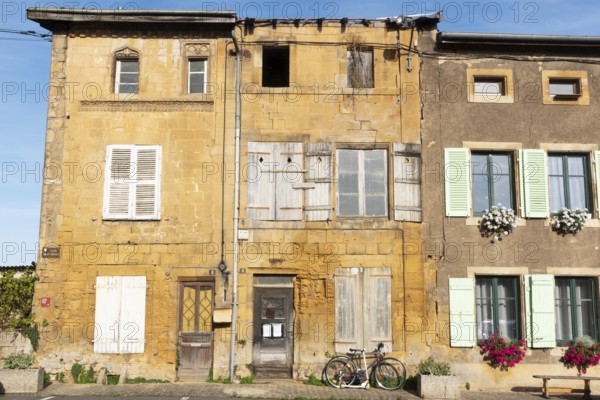 Historic house façade, yellow sandstone, Marville, Renaissance village, Département Meuse, Grand Est, France