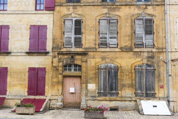 Historic house facade, abandoned building, yellow sandstone, Marville, Renaissance village, Département Meuse, Grand Est, France