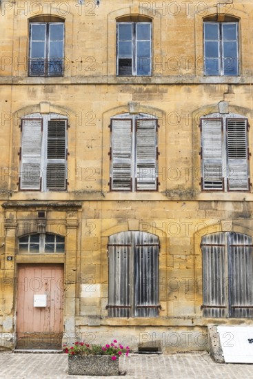 Historic house facade, abandoned building, yellow sandstone, Marville, Renaissance village, Département Meuse, Grand Est, France