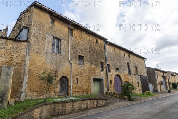Abandoned street with historic house facades, yellow sandstone, Marville, Renaissance village, Département Meuse, Grand Est, France