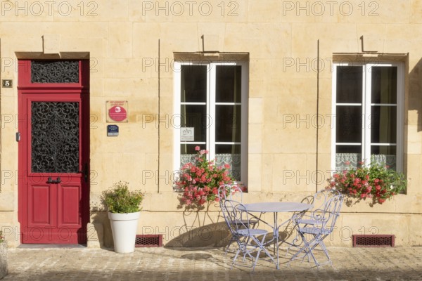 Entrance decorated with flowers, table and chairs, Marville, Renaissance village, Département Meuse, Grand Est, France