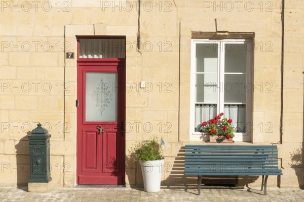 Entrance decorated with flowers, bench, Marville, Renaissance village, Département Meuse, Grand Est, France