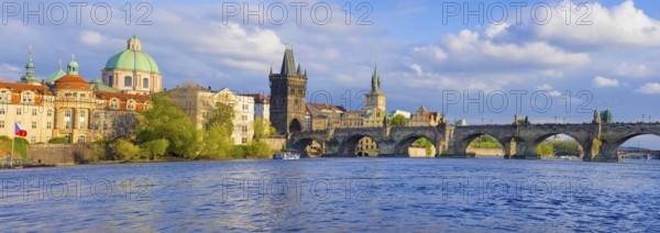 Panorama of old town with Charles Bridge on Vltava river and Old Town Bridge Tower, famous tourist destination in Prague, Czech Republic