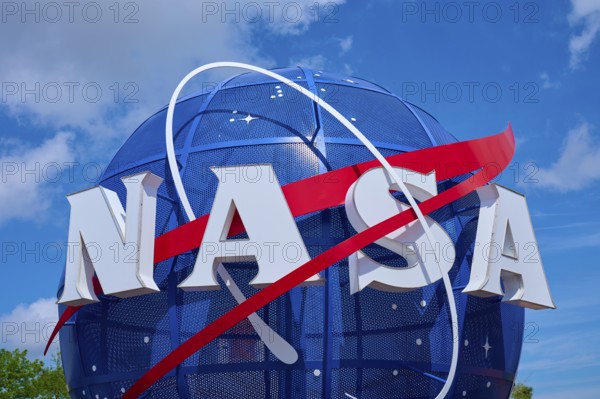 NASA logo in front of a blue, cloudy sky, Kennedy Space Centre Visitor Complex, Merritt Island, Florida, USA
