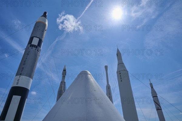 Rockets under bright sunshine, with a cloud in the blue sky, Kennedy Space Centre Visitor Complex, Merritt Island, Florida, USA