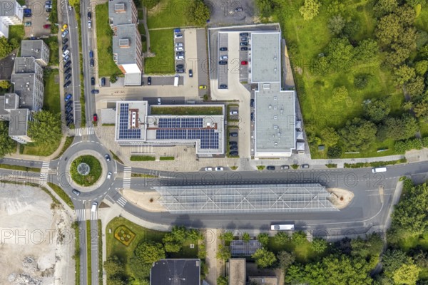 Aerial view, bus station with roundabout and savings bank building with solar roof in Schönhausen, Bergkamen, Ruhr area, North Rhine-Westphalia, Germany, authority, bus station, bus station roof, DE, Europe, roundabout, roundabout, aerial view, aerial photography, aerial photography, photovoltaic, photovoltaic system, town hall, solar, solar system, solar roof, solar energy, city administration, overview, bird's eye view, birds-eyes view, overview