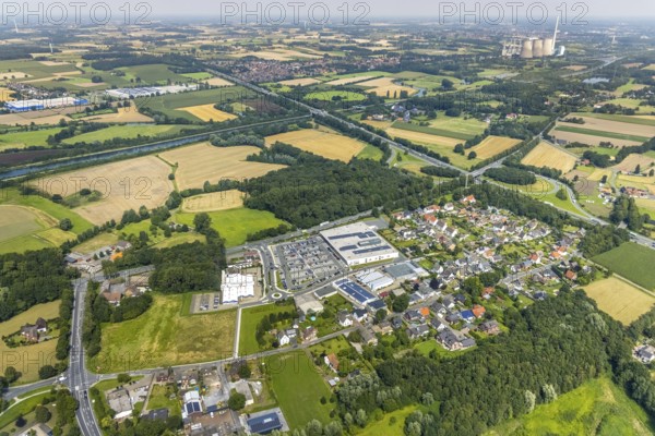 Aerial view, shopping centre An der Bummannsburg with Kaufland and Deichmann in Rünthe and RWE Power AG power plant Gersteinwerk in Werne in the background, Bergkamen, Ruhr area, North Rhine-Westphalia, Germany, DE, shopping markets, shopping place, shopping centre, Europe, power plant, aerial view, aerial photography, aerial photography, local supply centre, overview, bird's-eye view, overview