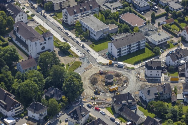 Aerial view, construction site and redesign of roundabout Pfarrer-Leo-Reiners-Platz, formerly Ehmsenplatz, Alter Holzweg, catholic St. Michael Church, Neheim, Arnsberg, Sauerland, North Rhine-Westphalia, Germany, place of worship, construction work, construction area, construction site, building plots, construction project, construction site, DE, Europe, religious community, place of worship, sacred site, Hochsauerlandkreis, church, church community, denomination, roundabout, roundabout, aerial view, aerial photography, aerial photography, religion, religious site, overview, bird's-eye view, birds-eyes view, overview