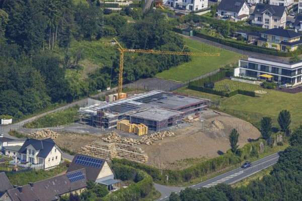 Aerial view, construction site new building Am Dollberg, Zur Waterlappe corner Zur Oldenburg, Neheim, Arnsberg, Sauerland, North Rhine-Westphalia, Germany, construction work, construction area, construction site, building plots, construction crane, construction project, construction site, DE, Europe, Hochsauerlandkreis, aerial photograph, aerial photography, aerial photography, new building, overview, bird's-eye view, bird's-eye view, overview
