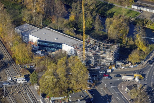 Aerial view, construction site with extension Eglo Leuchten Handels GmbH in the district Neheim in Arnsberg, Sauerland, North Rhine-Westphalia, Germany, extension, Arnsberg, construction work, construction area, construction site, building plots, construction crane, construction project, construction site, DE, Europe, Kleinbahnstraße, aerial view, aerial photography, aerial photography, new building, overview, bird's eye view, birds-eyes view, overview