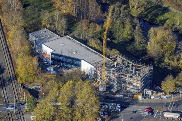 Aerial view, construction site with extension Eglo Leuchten Handels GmbH in the district Neheim in Arnsberg, Sauerland, North Rhine-Westphalia, Germany, extension, Arnsberg, construction work, construction area, construction site, building plots, construction crane, construction project, construction site, DE, Europe, Kleinbahnstraße, aerial view, aerial photography, aerial photography, new building, overview, bird's eye view, birds-eyes view, overview