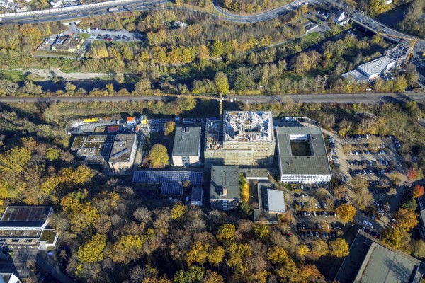 Aerial view, construction site and new building at the Berufskolleg Berliner Platz in the district Hüsten in Arnsberg, Sauerland, North Rhine-Westphalia, Germany, Arnsberg, construction work, construction area, construction site, building plots, construction crane, construction project, construction site, DE, Europe, aerial view, aerial photography, aerial photography, new building, overview, bird's eye view, birds-eyes view, overview
