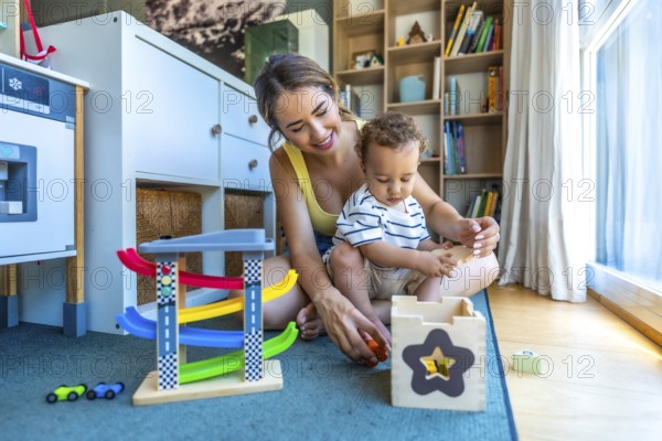 Happy mother and son playing together with educational wooden toys, enjoying quality time on the floor of their living room