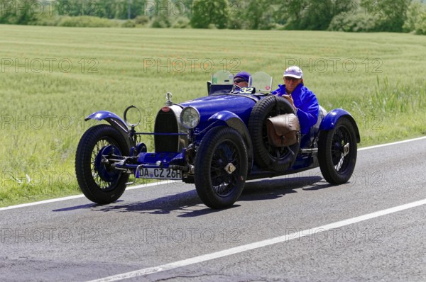 Blue vintage car with male occupants on rural road next to wheat fields, vintage car, car race, Mille Miglia, 1000 Miglia, 2015, Tuscany, Rome Lake Garda, Italy